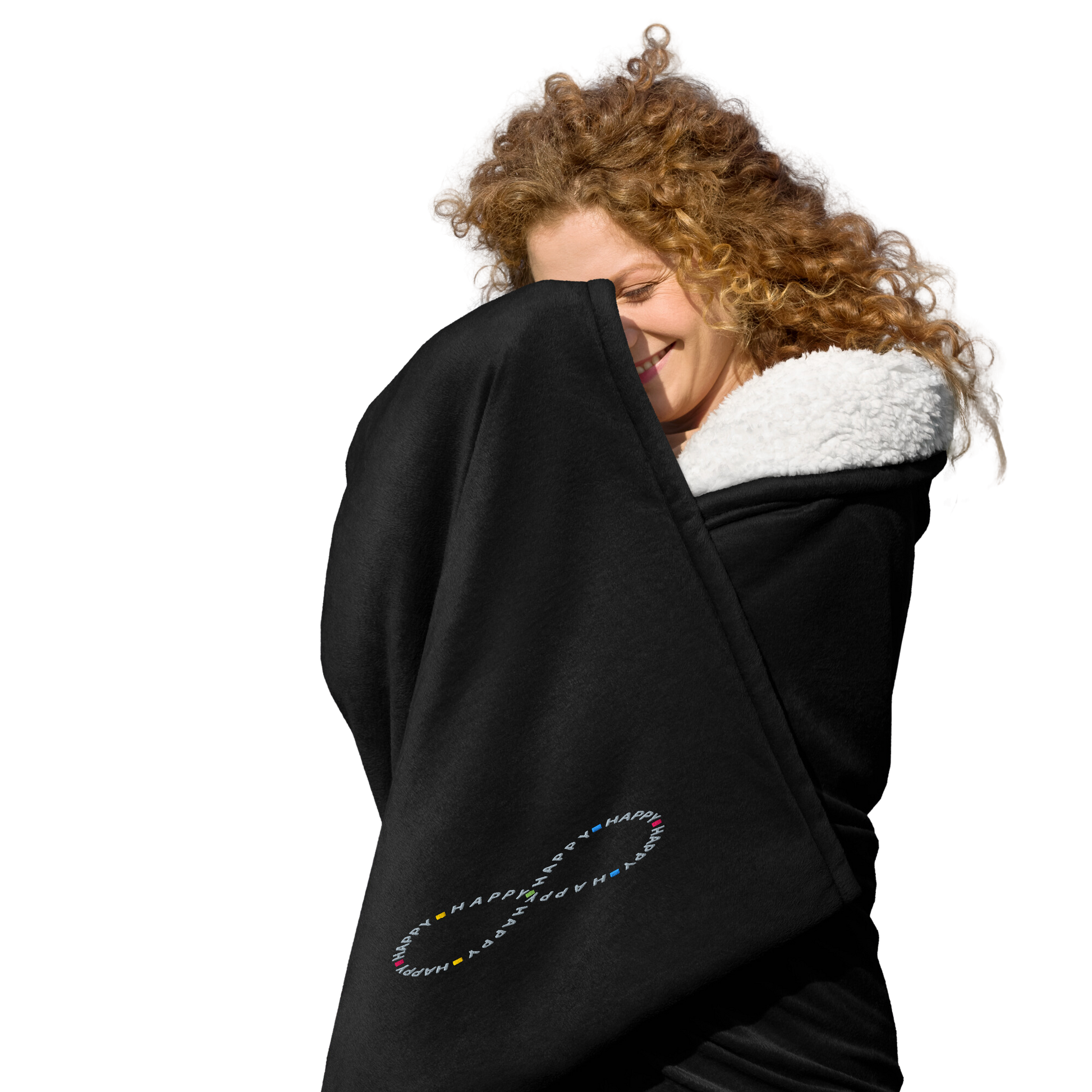 Happy young woman wrapped in soft black sherpa throw blanket with a happy embroidered infinity symbol HappyStuff