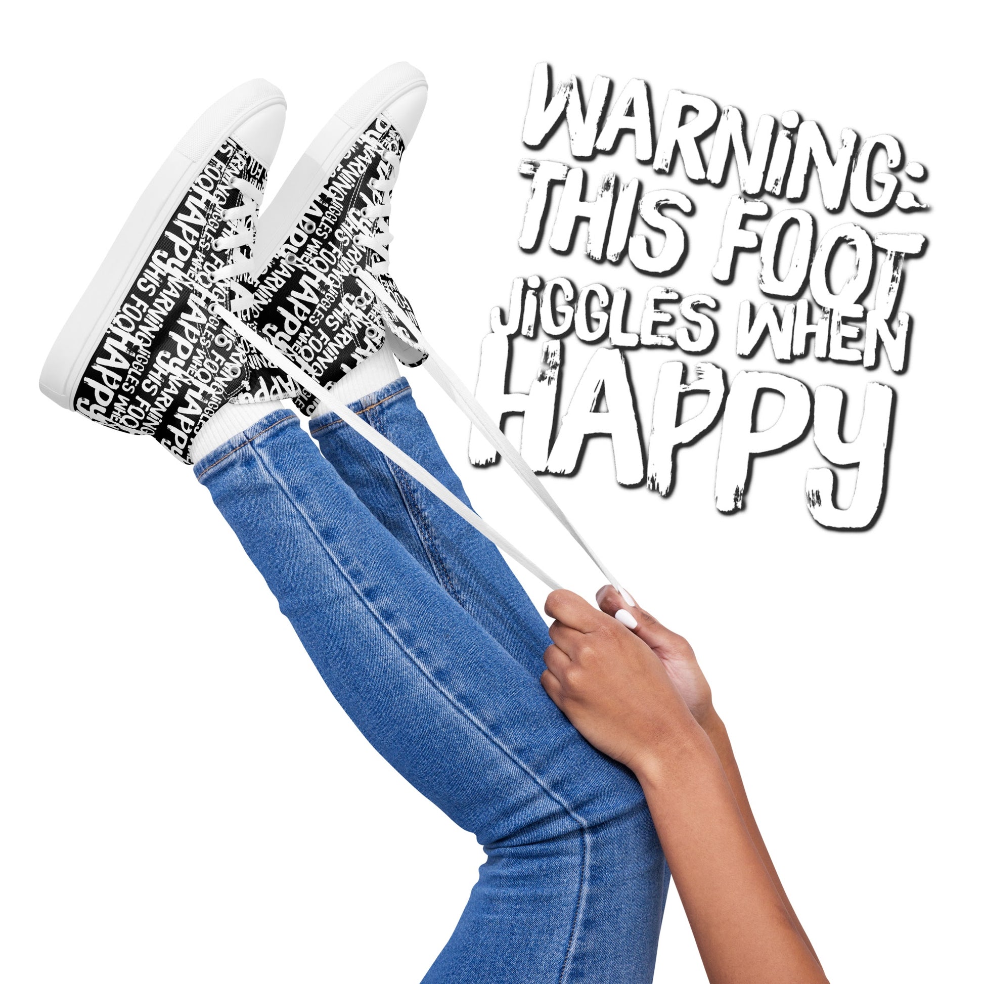 Womens feet in the air holding laces of HappyStuff black and white high tops fun print Warning This Foot Jiggles When Happy