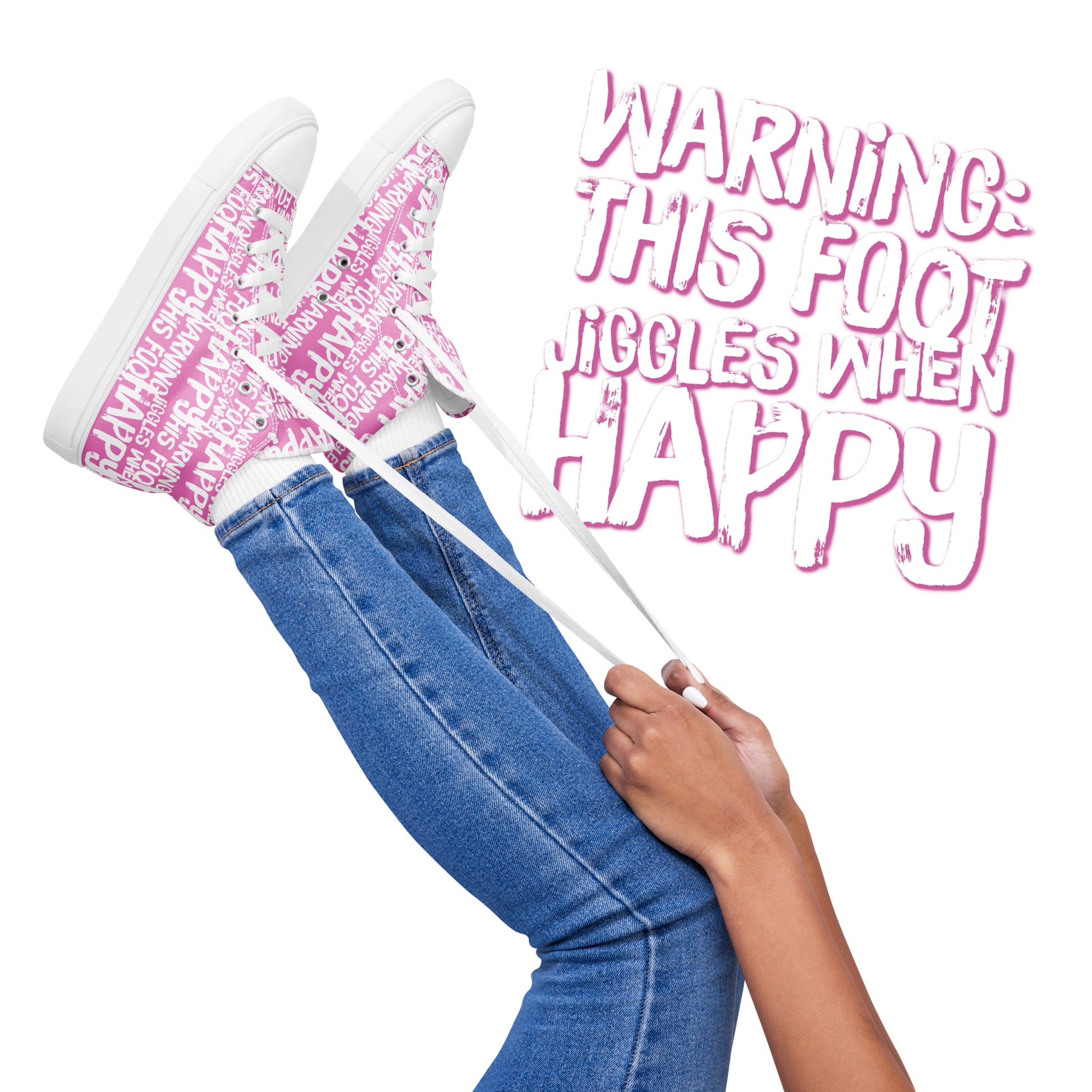 Womens feet in the air holding laces of HappyStuff pink and white high tops fun print Warning This Foot Jiggles When Happy