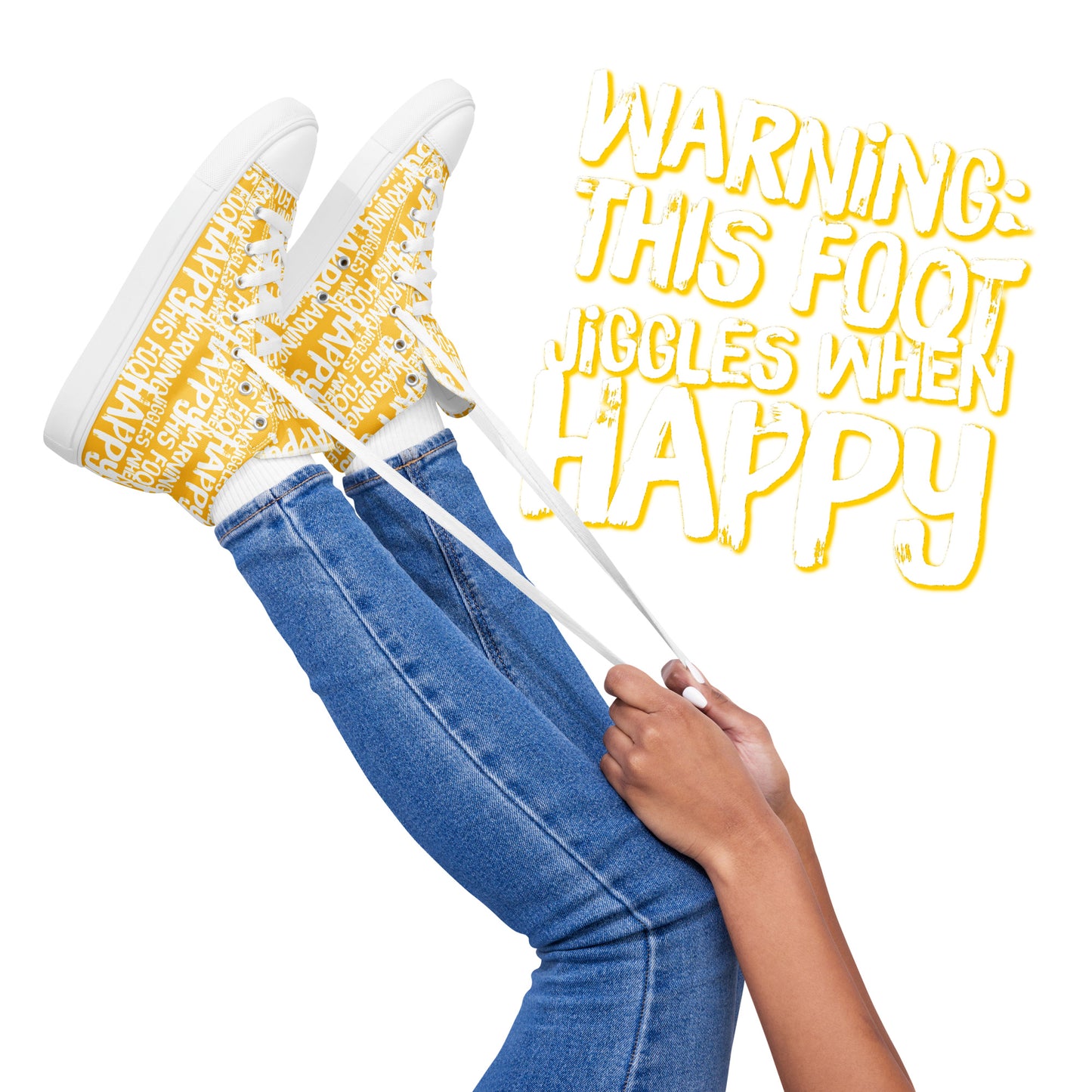 Womens feet in the air holding laces of HappyStuff yellow and white high tops fun print Warning This Foot Jiggles When Happy