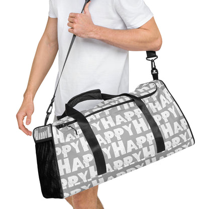 Duffle bag Happy sponge print black and white on grey water-resistant durable gym bag HappyStuff Brand Side view hanging on mans left shoulder