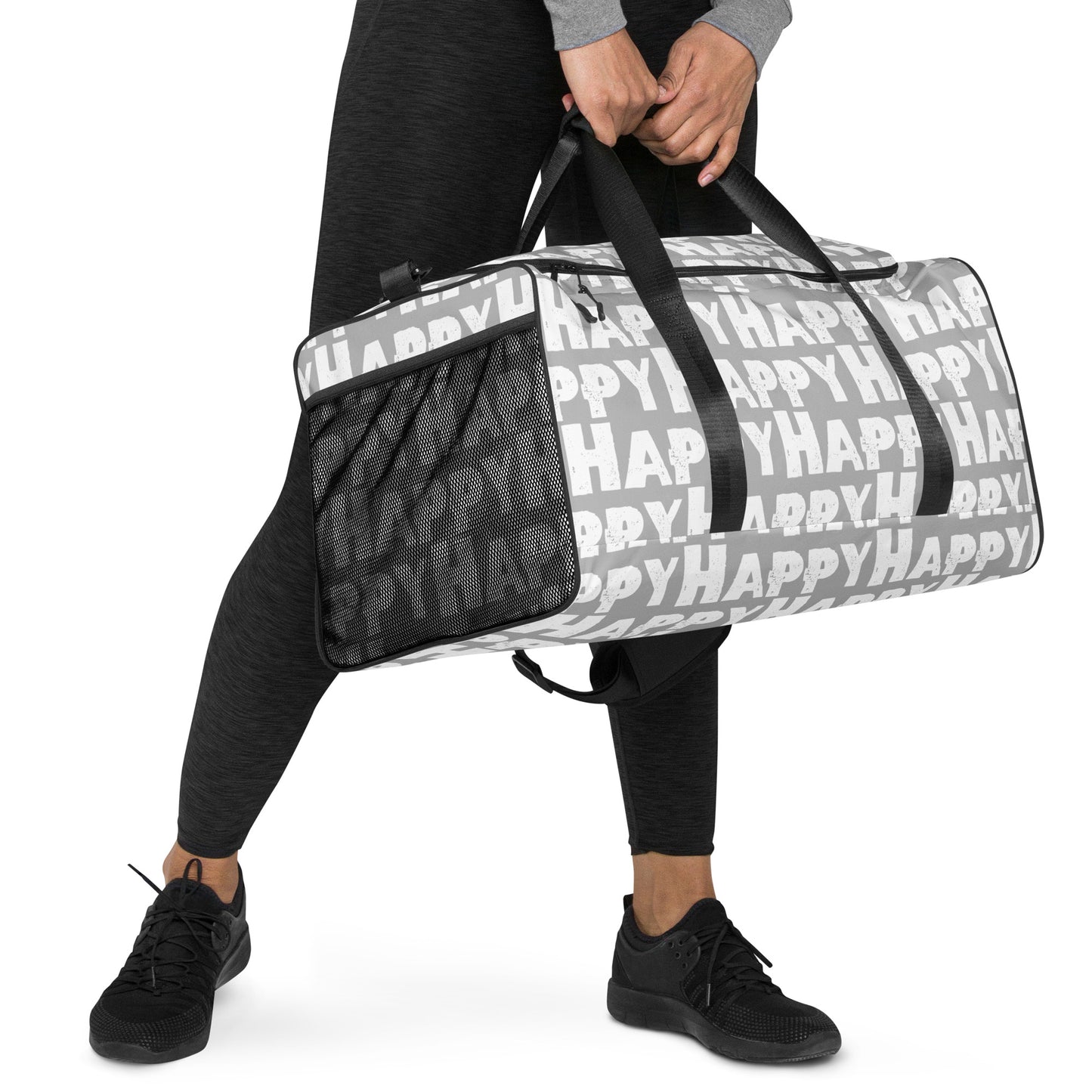 Hands carrying Duffle bag Happy sponge print black and white on grey water-resistant durable gym bag padded handles HappyStuff Brand