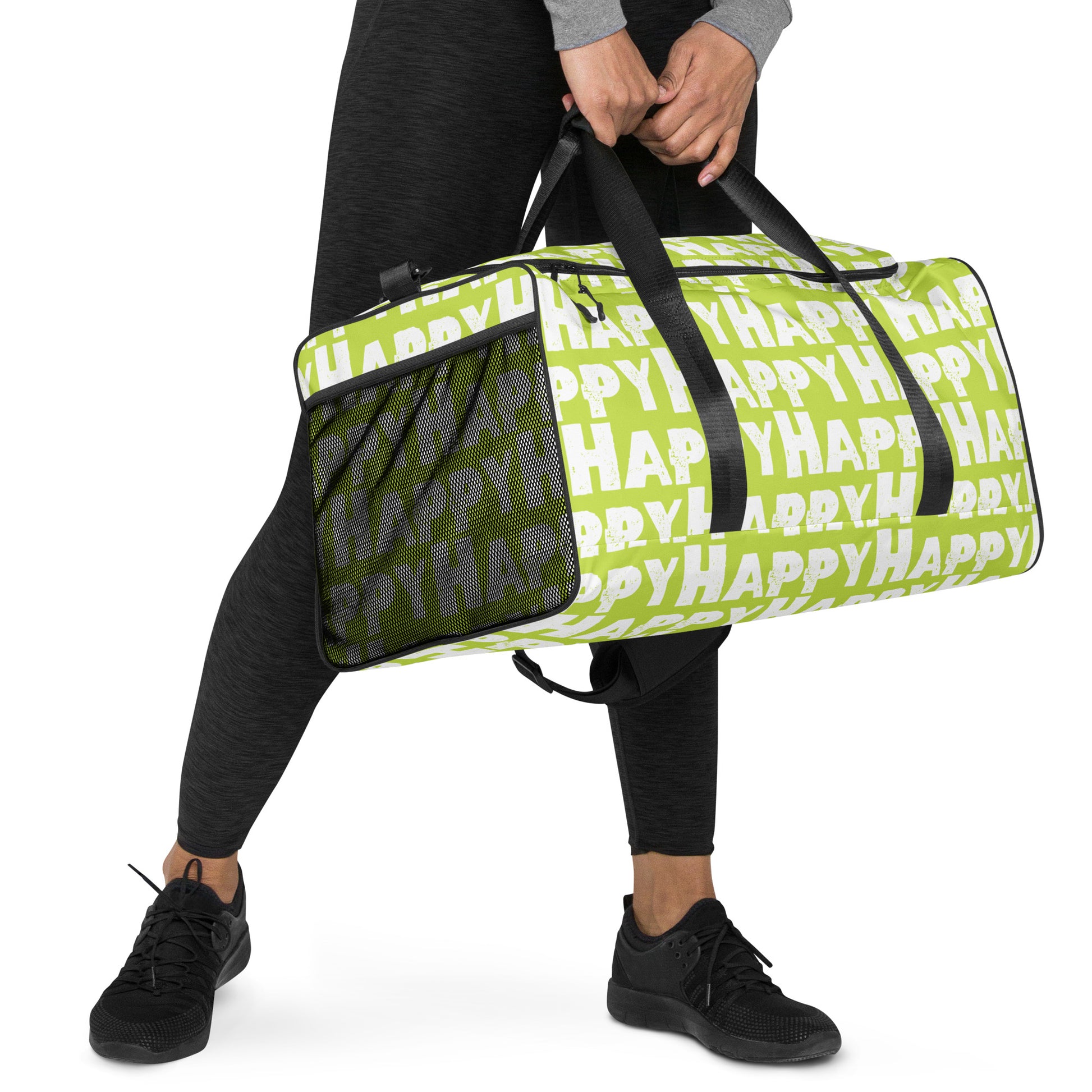 Hands carrying Duffle bag Happy sponge print black and white on green water-resistant durable gym bag padded handles HappyStuff Brand