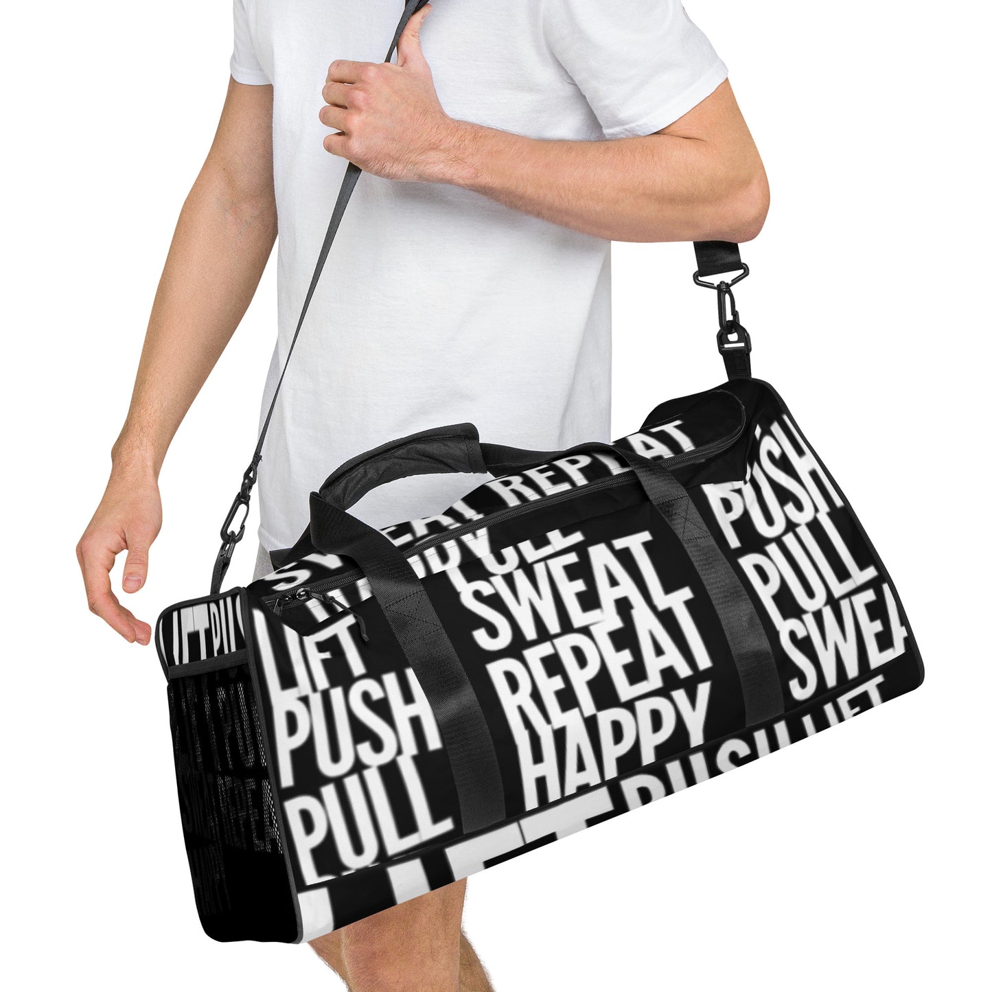 Duffle bag Lift Push Pull Sweat Repeat Happy all over print in black with white gym bag HappyStuff Brand Side view hanging on mans left shoulder