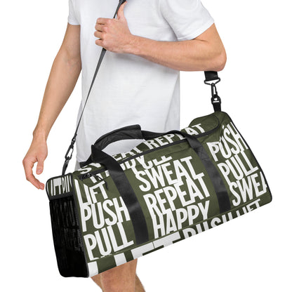 Duffle bag Lift Push Pull Sweat Repeat Happy all over print in khaki green with white gym bag HappyStuff Brand Side view hanging on mans left shoulder