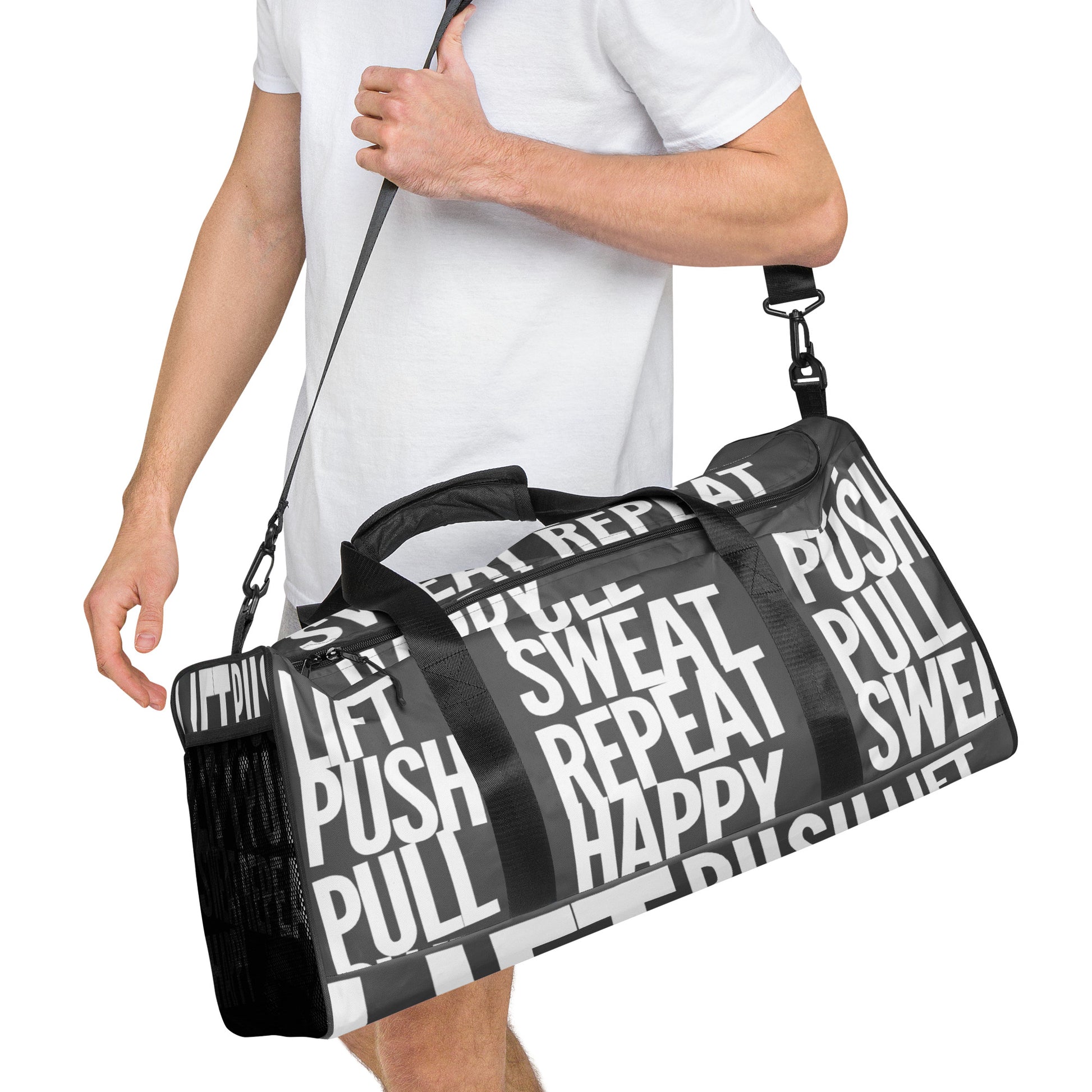 Duffle bag Lift Push Pull Sweat Repeat Happy all over print in slate grey with white gym bag HappyStuff Brand Side view hanging on mans left shoulder