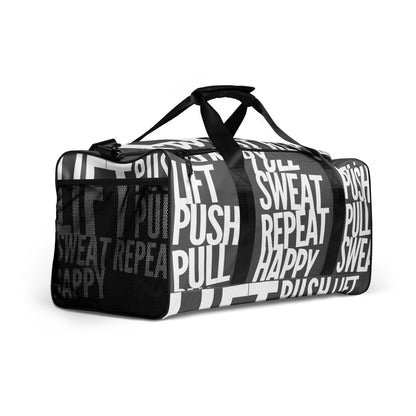 Duffle bag Lift Push Pull Sweat Repeat Happy all over print slate grey and white gym bag mesh outer pocket padded handles side angle HappyStuff Brand