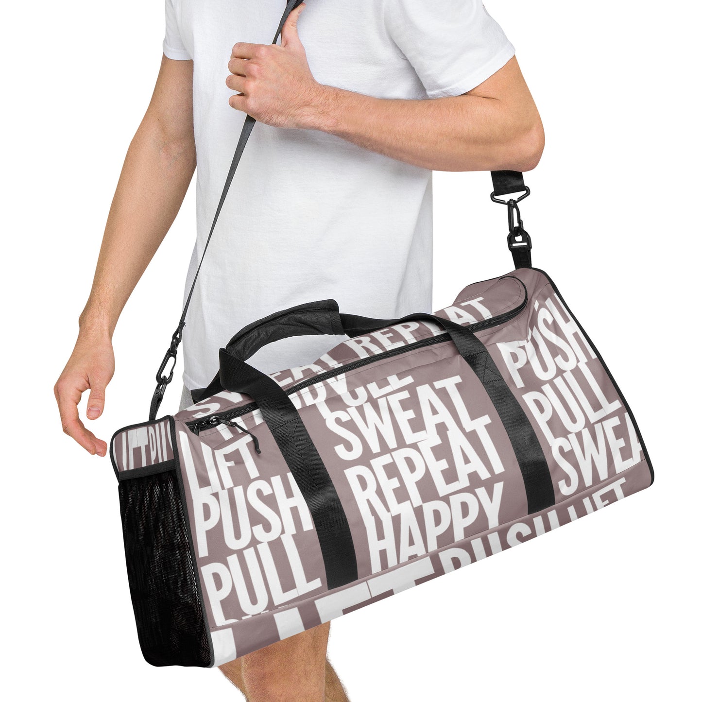 Duffle bag Lift Push Pull Sweat Repeat Happy all over print in taupe with white gym bag HappyStuff Brand Side view hanging on mans left shoulder