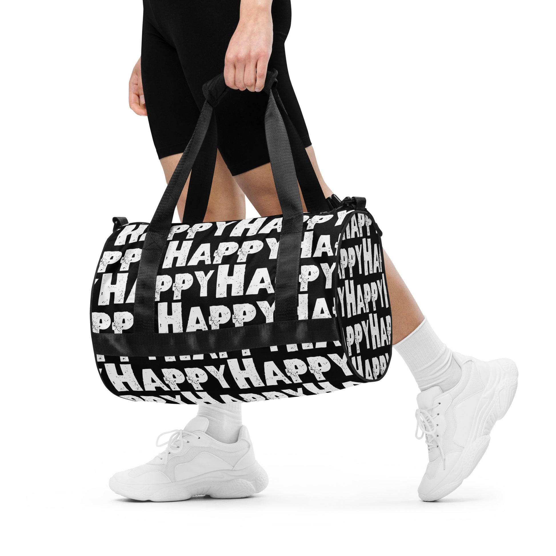 Woman carrying gym bag Happy sponge print black and white water-resistant durable small duffle bag padded handles HappyStuff Brand 