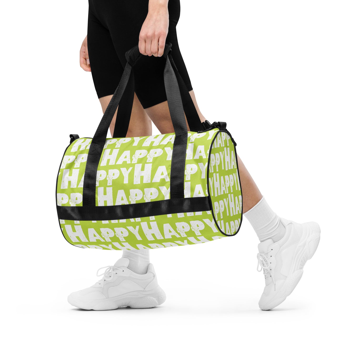 Woman carrying gym bag Happy sponge print black white on green water-resistant durable small duffle bag padded handles HappyStuff Brand