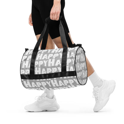 Woman carrying gym bag Happy sponge print black white on grey water-resistant durable small duffle bag padded handles HappyStuff Brand