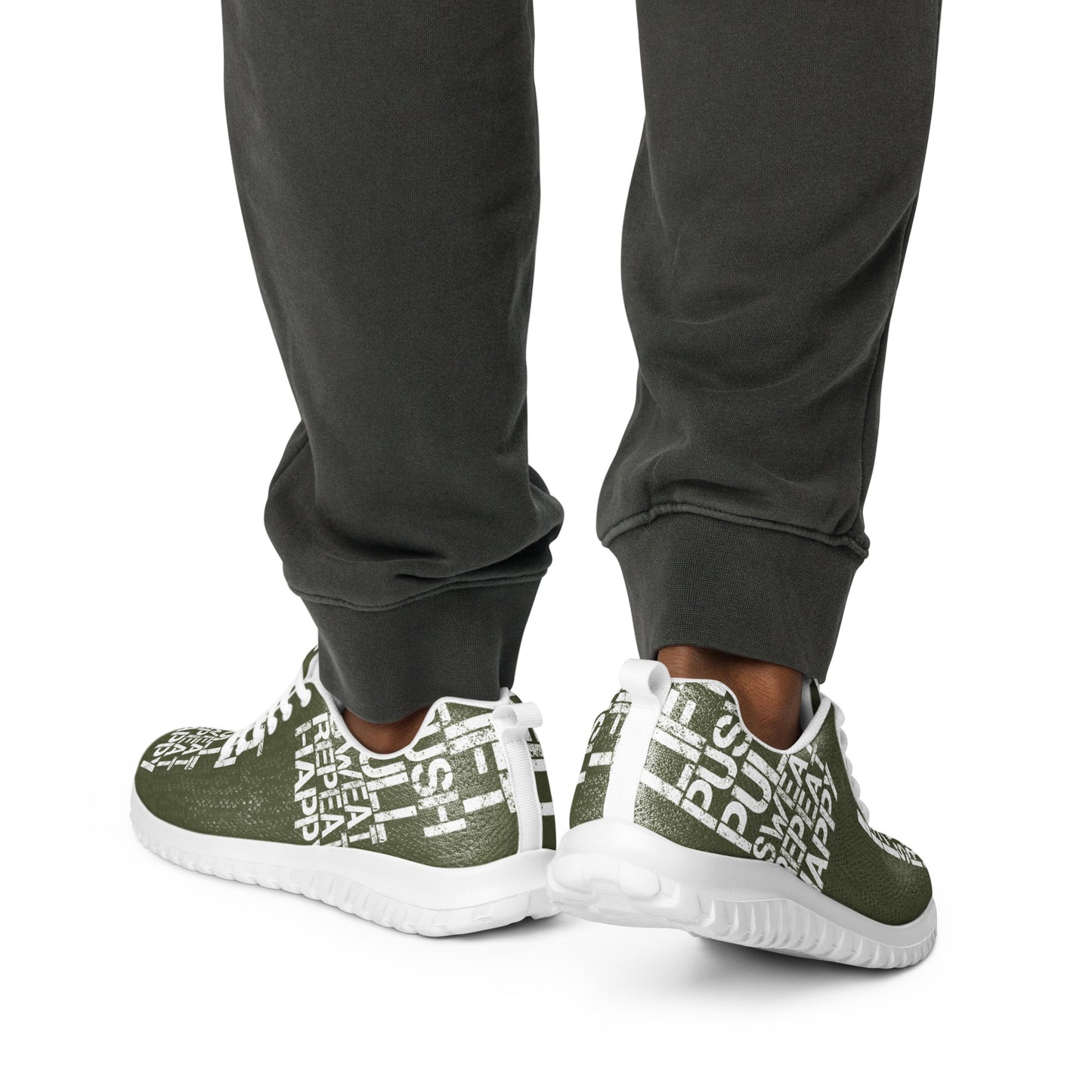 Man walking away lightweight khaki green sneakers white lift push pull sweat repeat happy distress print mens athletic shoes serrated sole pull tab