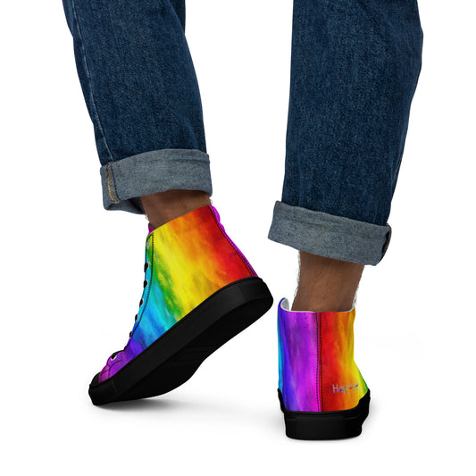 Close up of rainbow shoes on a man walking away holi colours printed on white high top sneakers black sole HappyStuff brand logo on right shoe