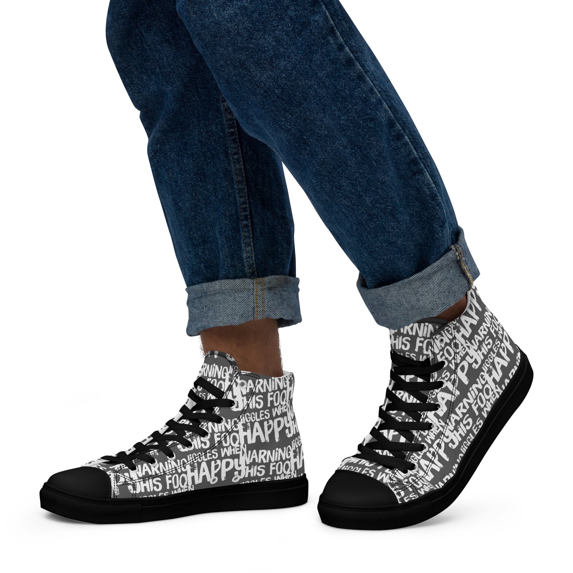 Walking left in mens HappyStuff high tops canvas sneakers edgy print slate grey and white shoes Warning This Foot Jiggles When Happy black sole