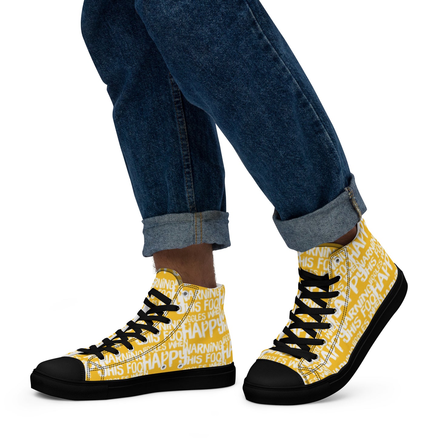 Walking left in mens HappyStuff high tops canvas sneakers edgy print yellow and white shoes Warning This Foot Jiggles When Happy black sole