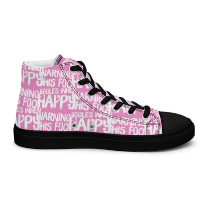 Left shoe inside view HappyStuff mens pink high top sneakers with playful white print Warning This Foot Jiggles When Happy black sole