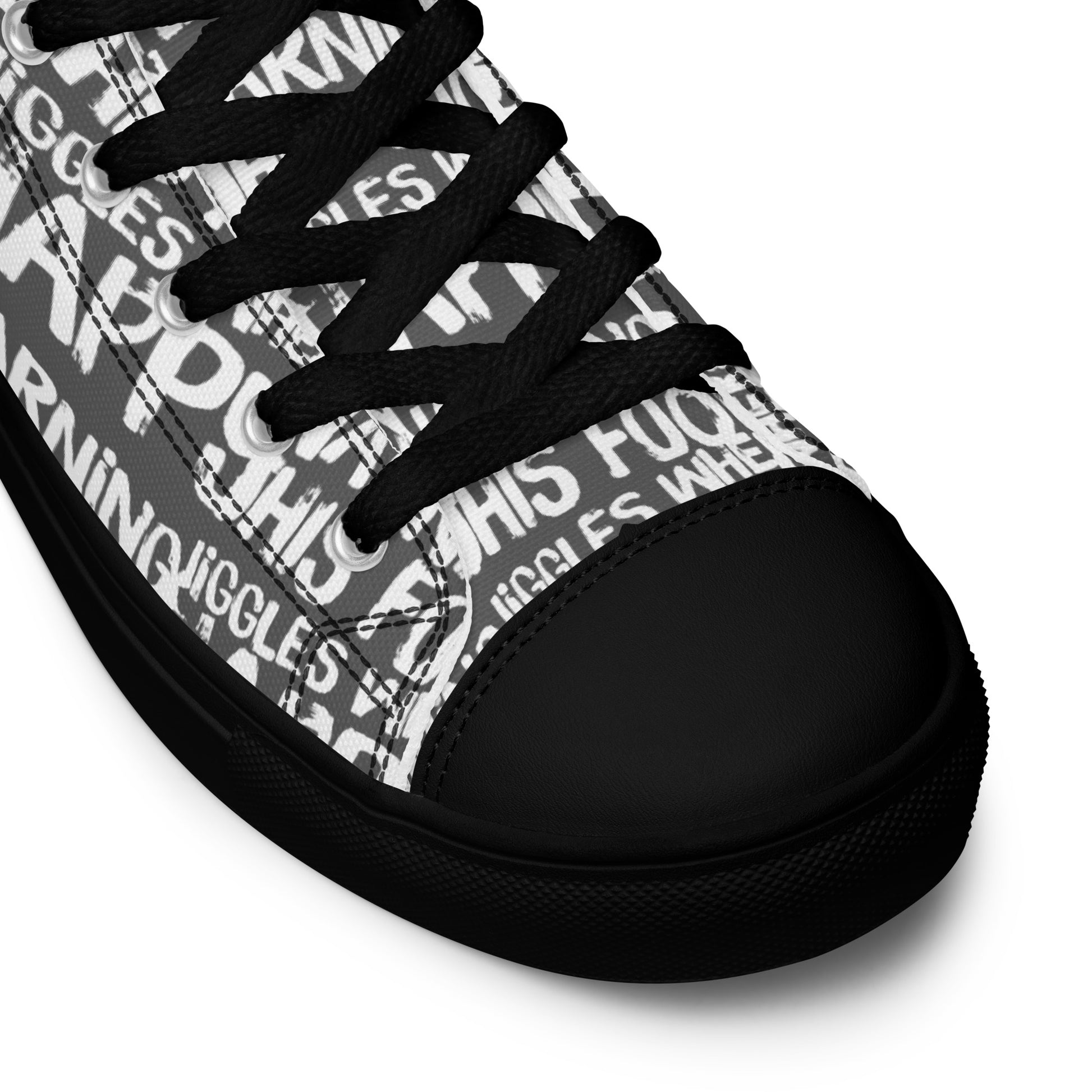 HappyStuff slate grey high tops with playful white print Warning This Foot Jiggles When Happy black laces faux leather toe cap closeup black sole