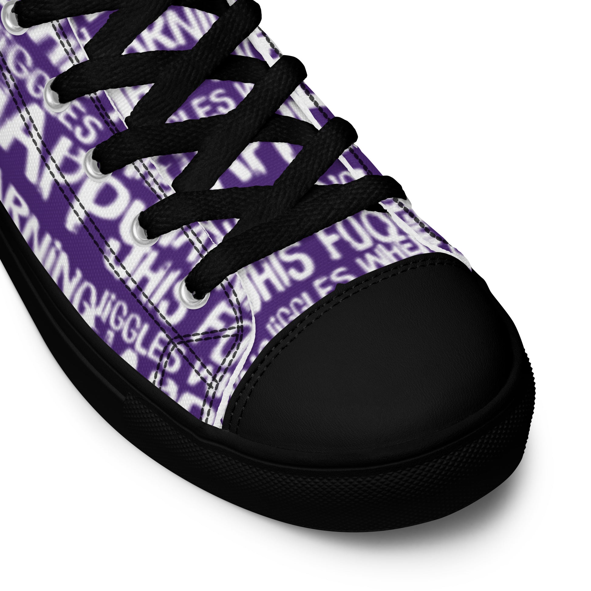 HappyStuff purple high tops with playful white print Warning This Foot Jiggles When Happy black laces faux leather toe cap closeup black sole