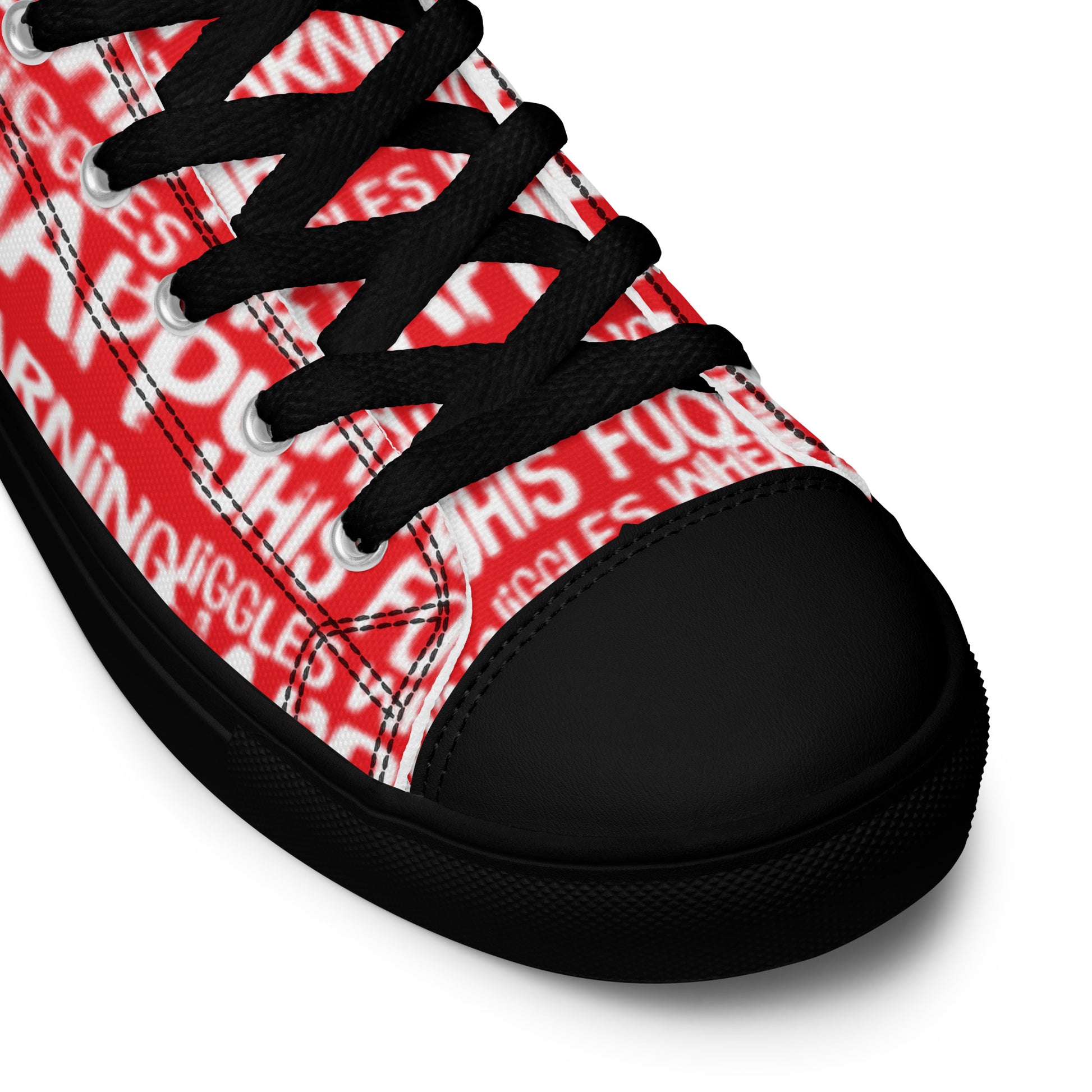 HappyStuff red high tops with playful white print Warning This Foot Jiggles When Happy black laces faux leather toe cap closeup black sole