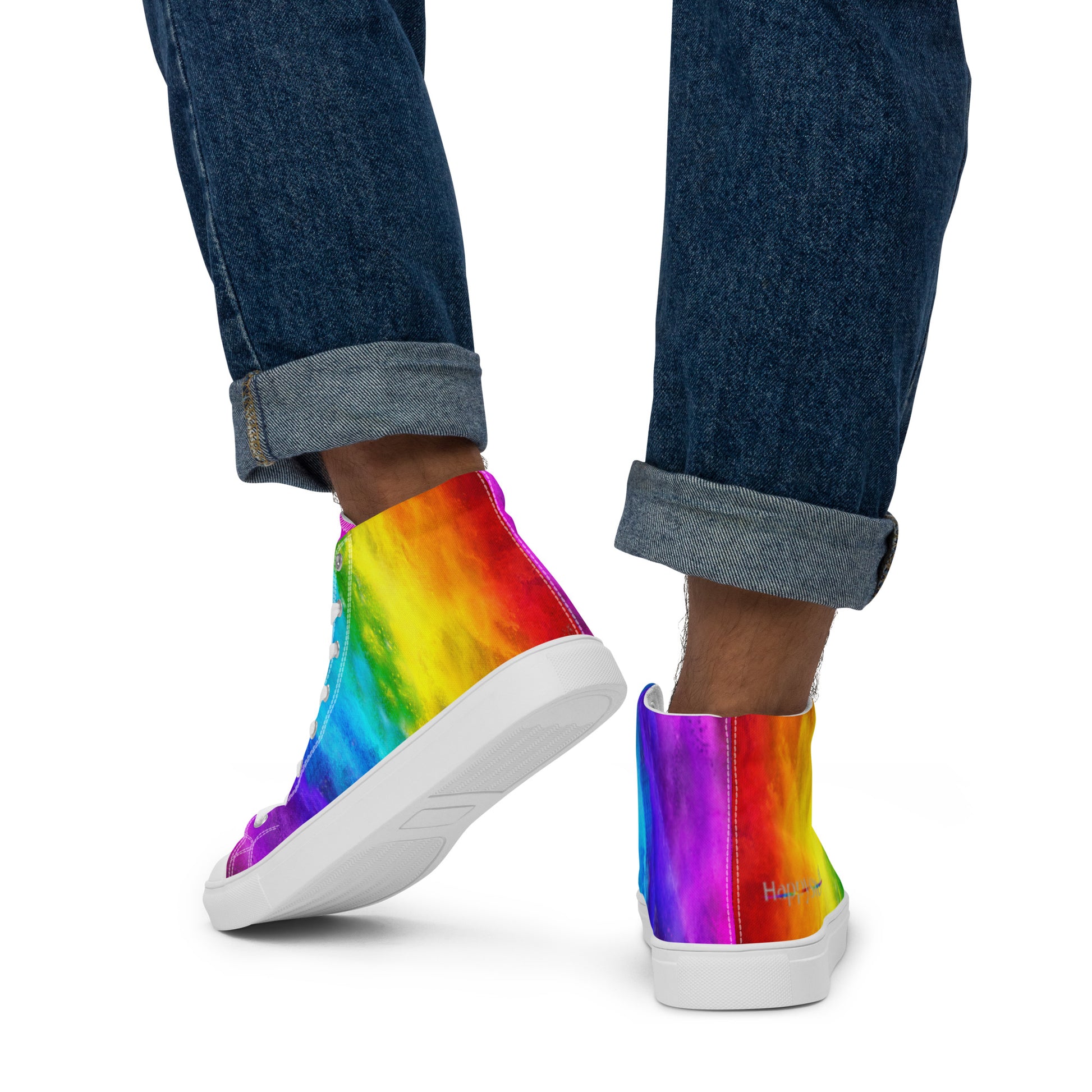 Close up of rainbow shoes on a man walking away holi colours printed on white high top sneakers HappyStuff brand logo on right shoe