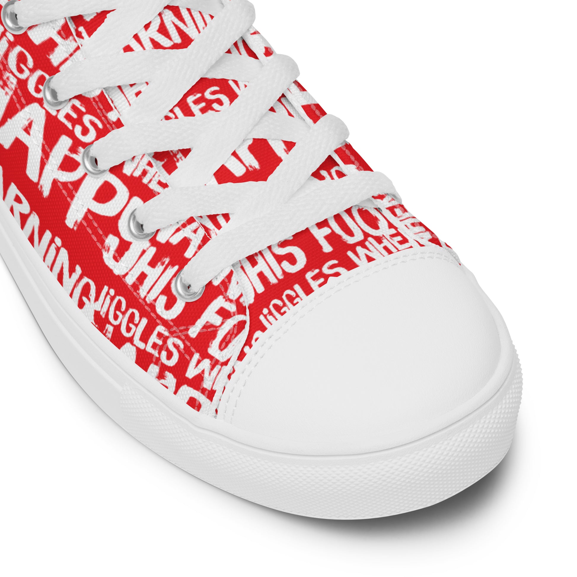 HappyStuff red high tops with playful white print Warning This Foot Jiggles When Happy white laces faux leather toe cap closeup