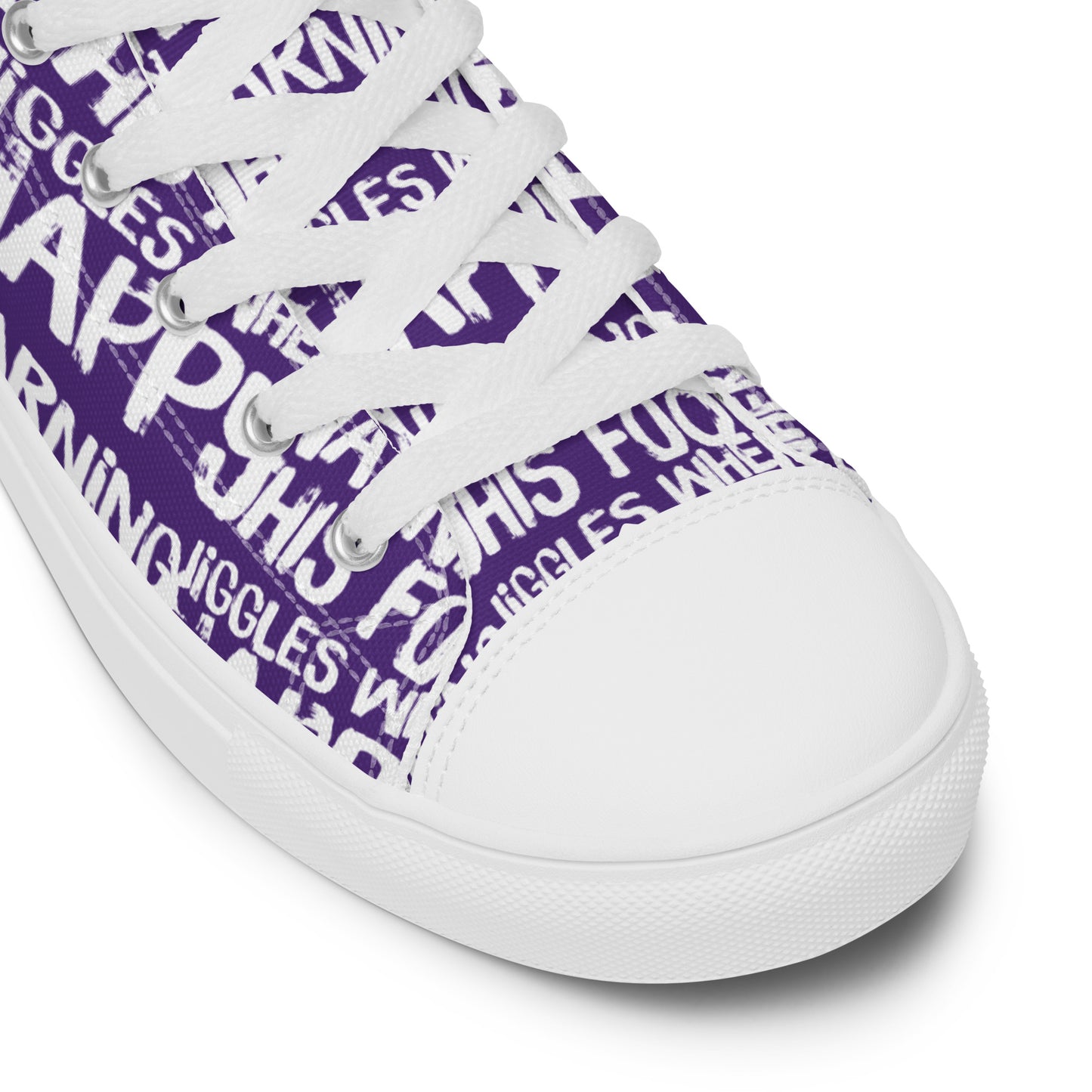 HappyStuff purple high tops with playful white print Warning This Foot Jiggles When Happy white laces faux leather toe cap closeup