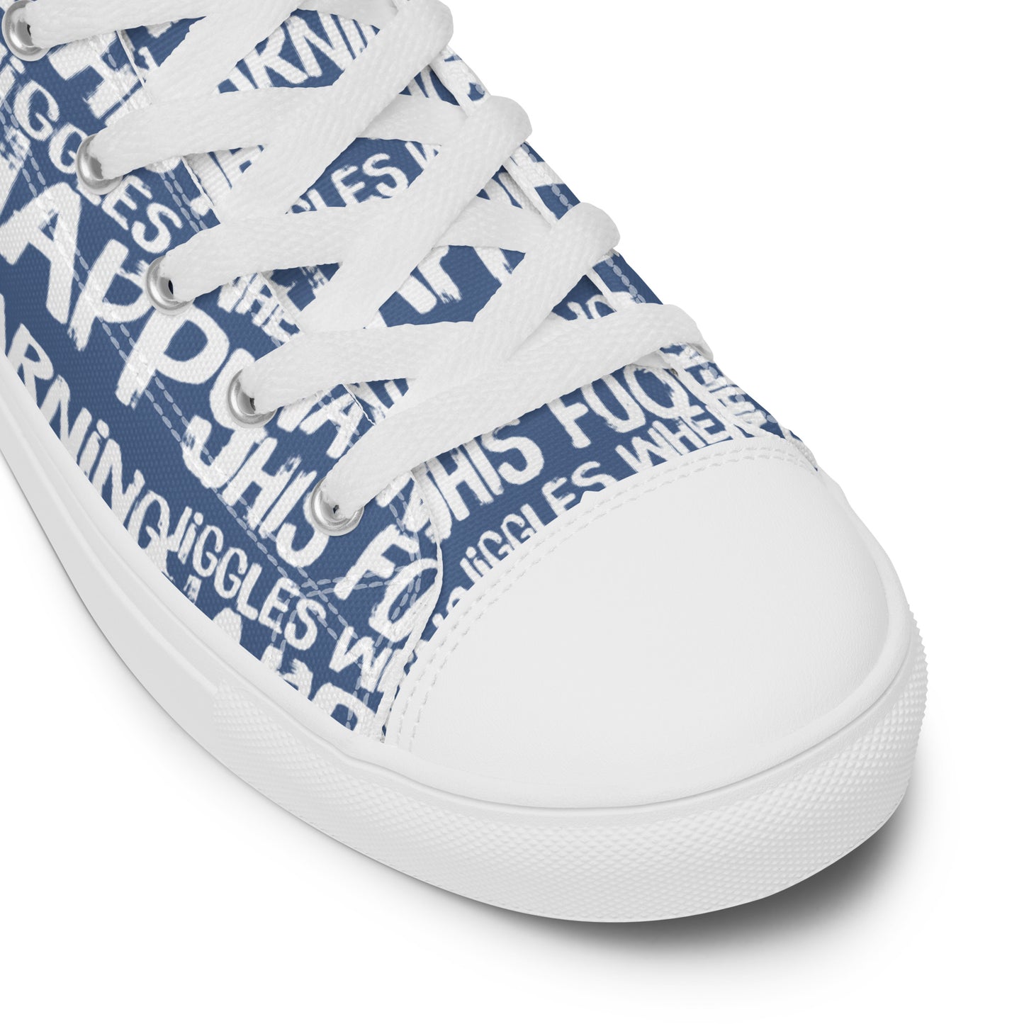 HappyStuff denim blue high tops with playful white print Warning This Foot Jiggles When Happy white laces faux leather toe cap closeup