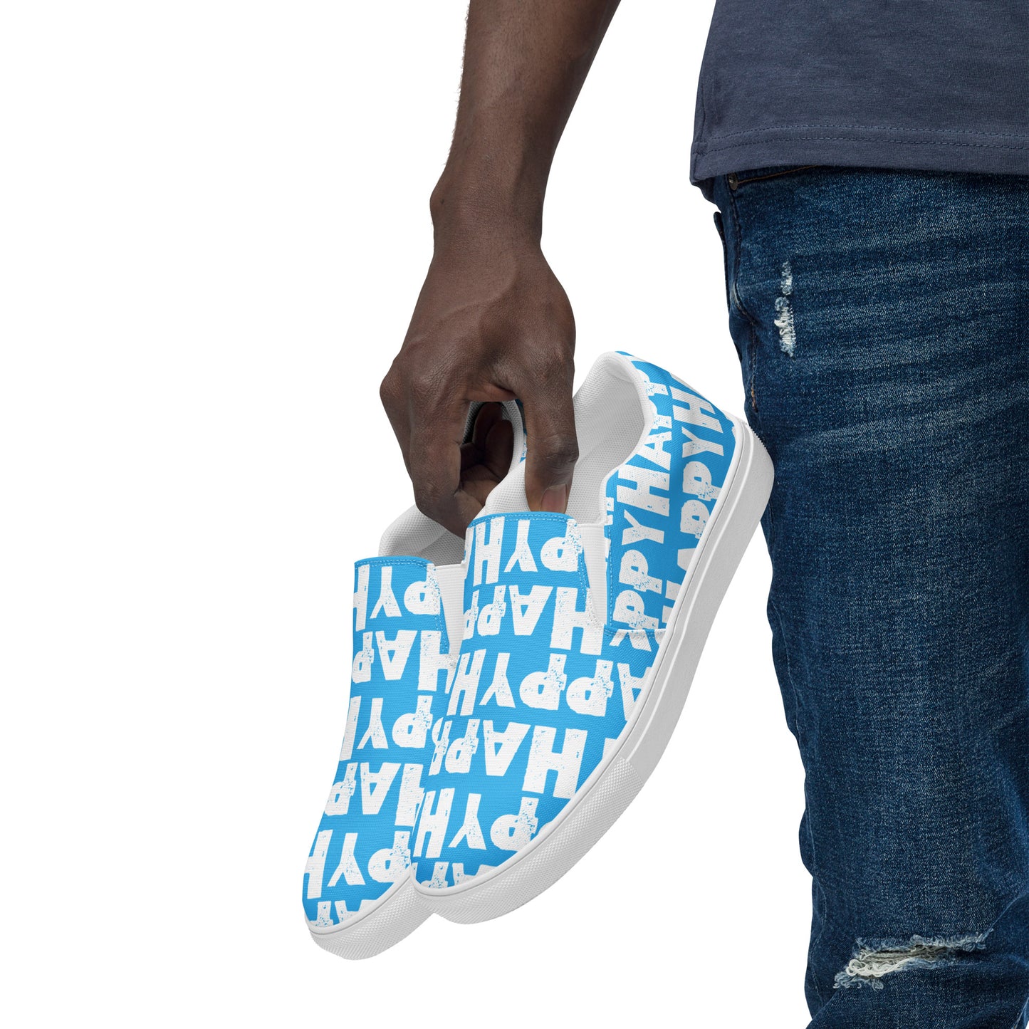 Mans hand holding happy shoes at his side fun blue and white sneakers Happy Sponge Printed HappyStuff canvas slip on shoes