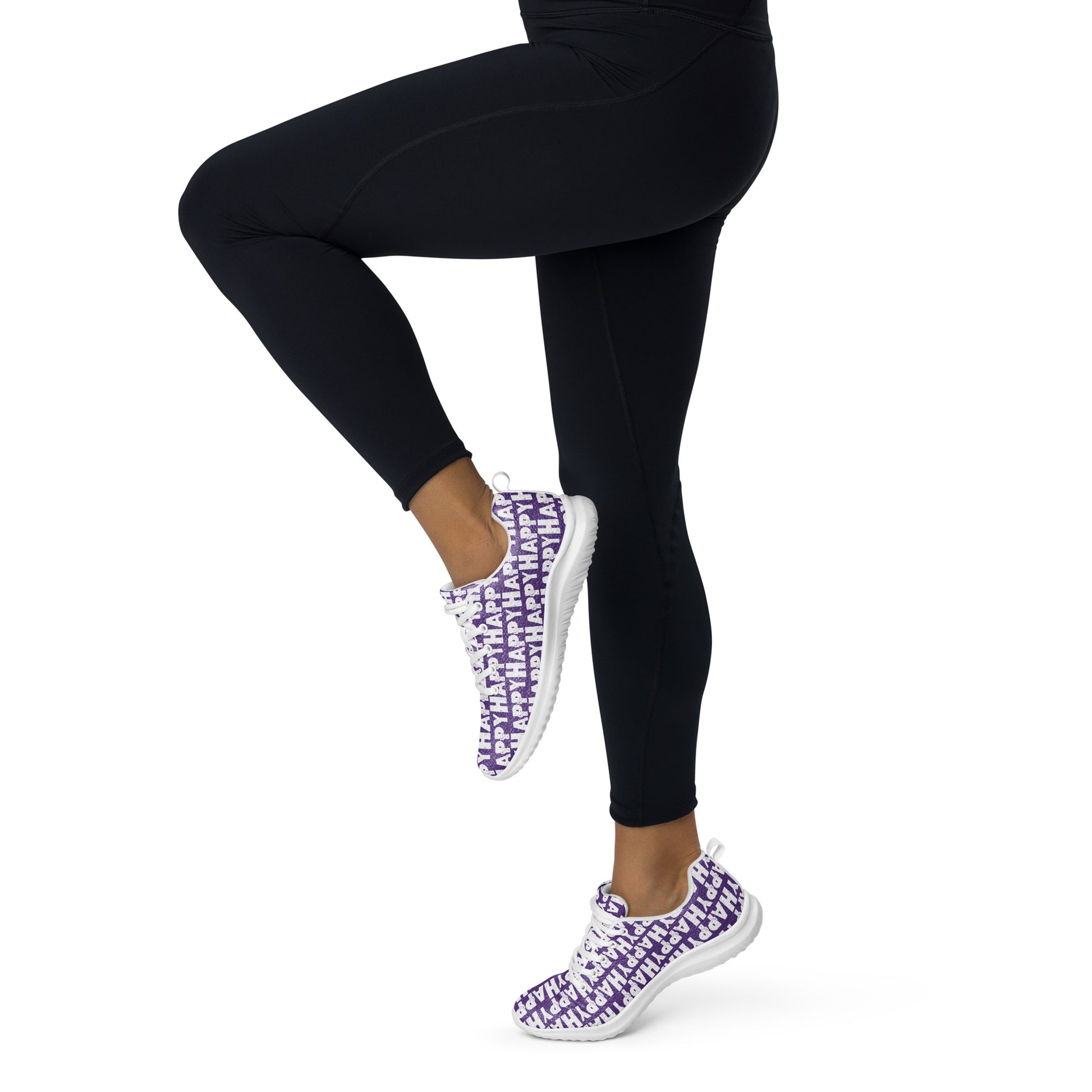 Happy Sponge Print lightweight purple sneakers HappyStuff brand athletic shoes worn by a woman in tights prancing away to the left