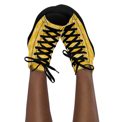 Womans sneaker clad feet in the air tapping toes of her high tops Happy Left Foot Happy Right Foot Pattern Print each on relevant shoe yellow and white shoes black sole