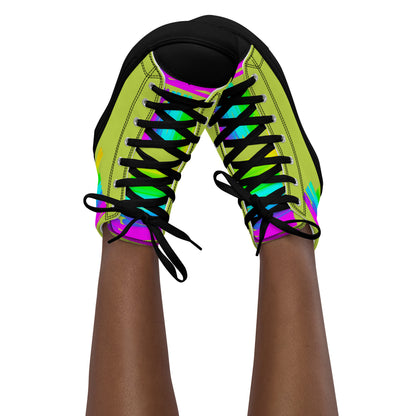 Feet in the air wearing womens sneakers tapping toes of her Happy Rainbow Painted bright colour spectrum print green high tops black sole