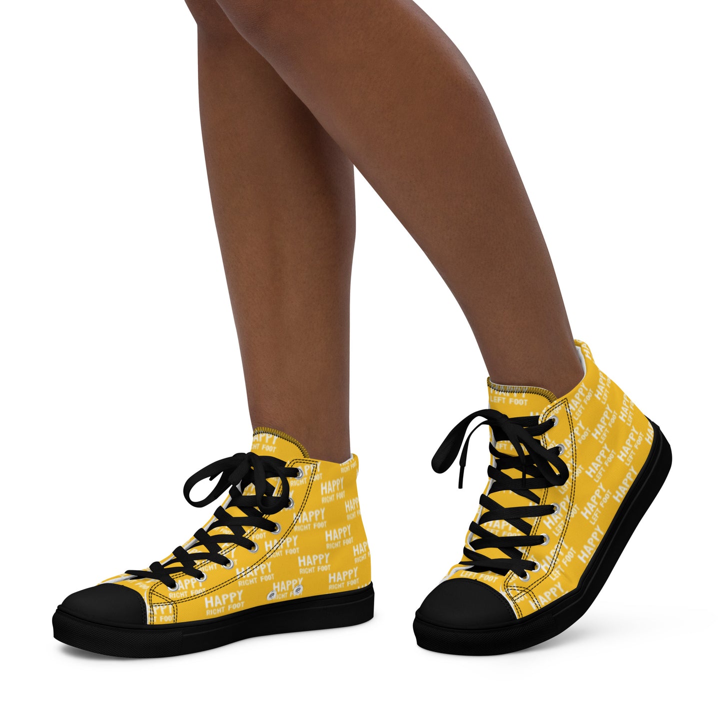 Walking left in womens HappyStuff high tops yellow canvas sneakers black sole Happy Left Foot Happy Right Foot Pattern Print each on relevant shoe