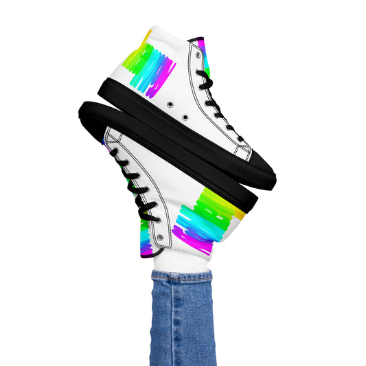 Womans right foot propping up Happy Rainbow Painted bright colour spectrum print white high tops black sole balancing left sneaker atop