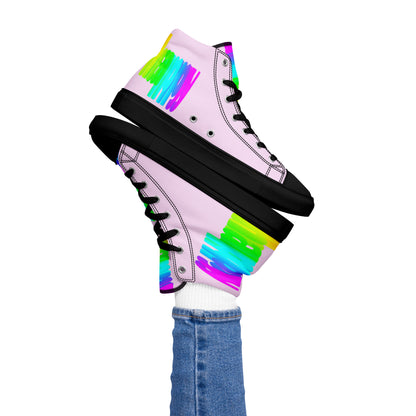 Womans right foot propping up Happy Rainbow Painted bright colour spectrum print pink high tops black sole balancing left sneaker atop