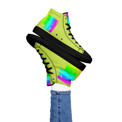 Womans right foot propping up Happy Rainbow Painted bright colour spectrum print green high tops black sole balancing left sneaker atop