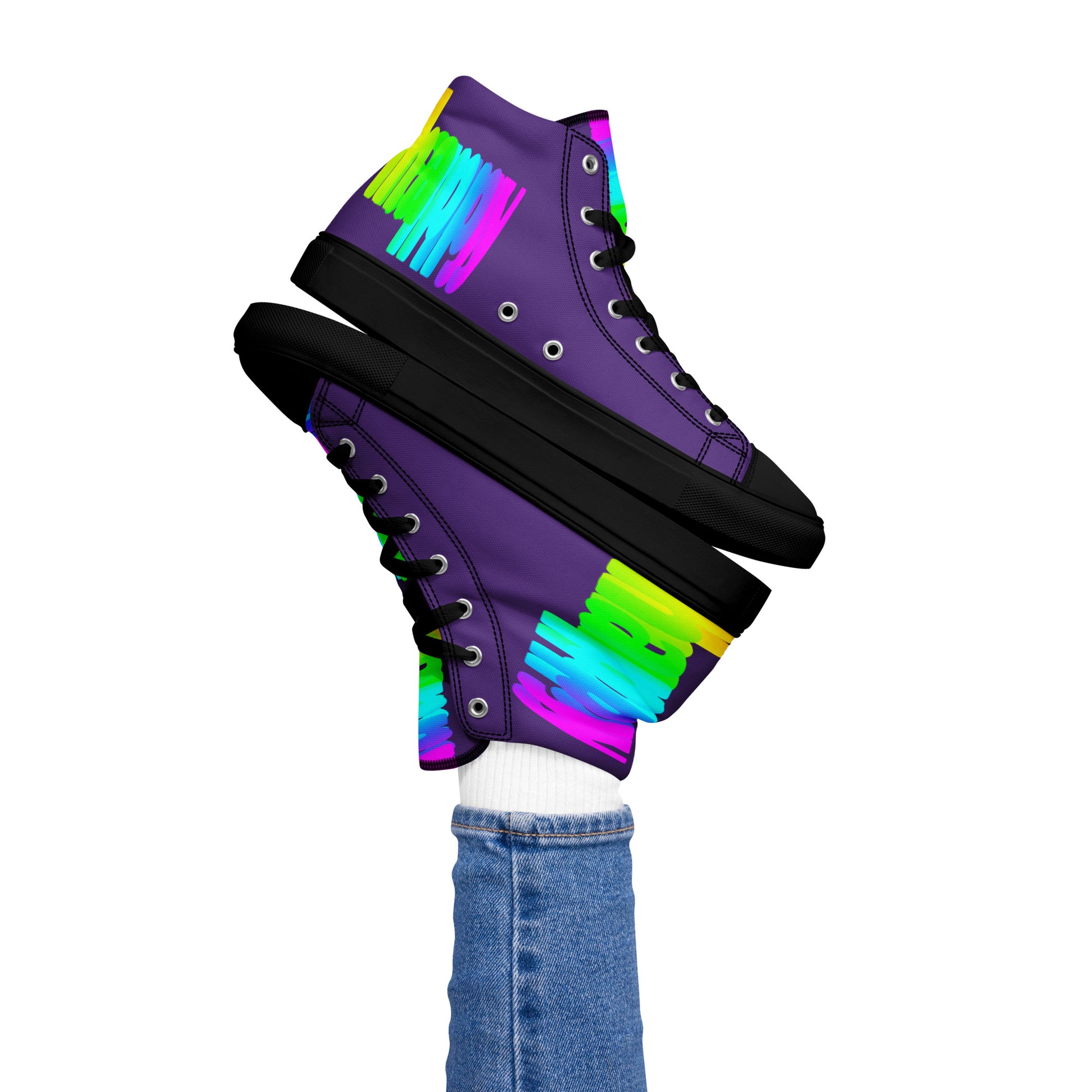 Womans right foot propping up Happy Rainbow Painted bright colour spectrum print purple high tops black sole balancing left sneaker atop