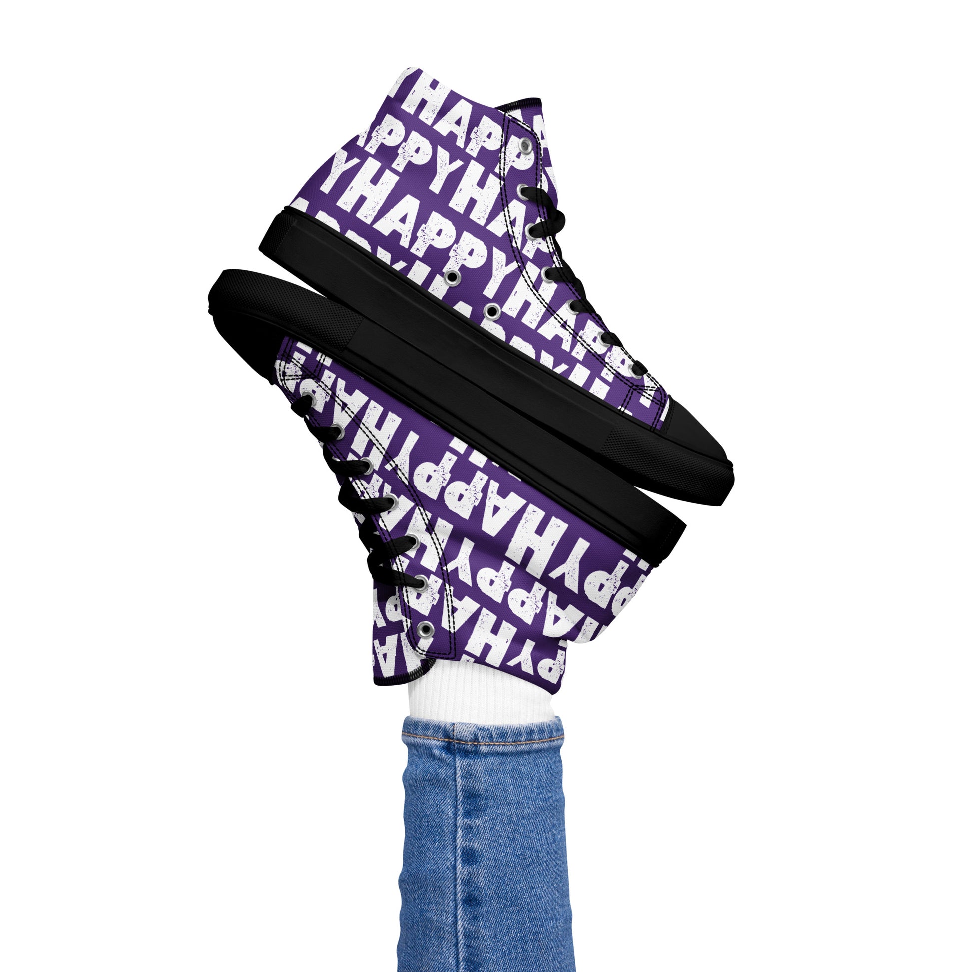 Womans right foot propping up a Happy Sponge Printed High Top Sneaker balancing left HappyStuff fun purple and white shoes black sole