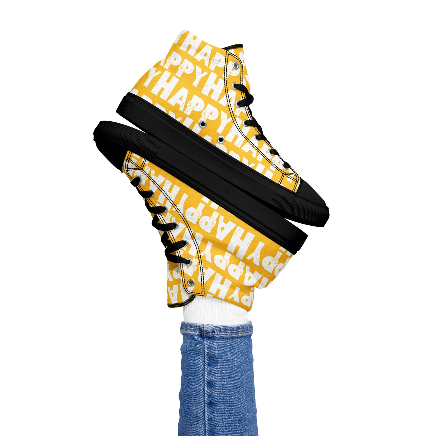 Womans right foot propping up a Happy Sponge Printed High Top Sneaker balancing left HappyStuff fun yellow and white shoes black sole