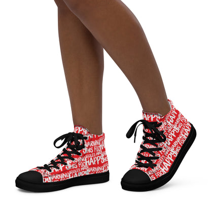 Womans feet walking in HappyStuff brand high top sneakers playful red and white print Warning This Foot Jiggles When Happy black sole