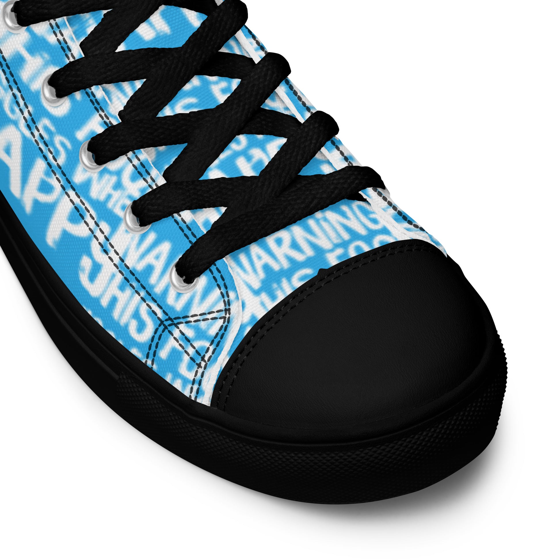 HappyStuff blue high tops with playful white print Warning This Foot Jiggles When Happy black laces faux leather toe cap closeup black sole