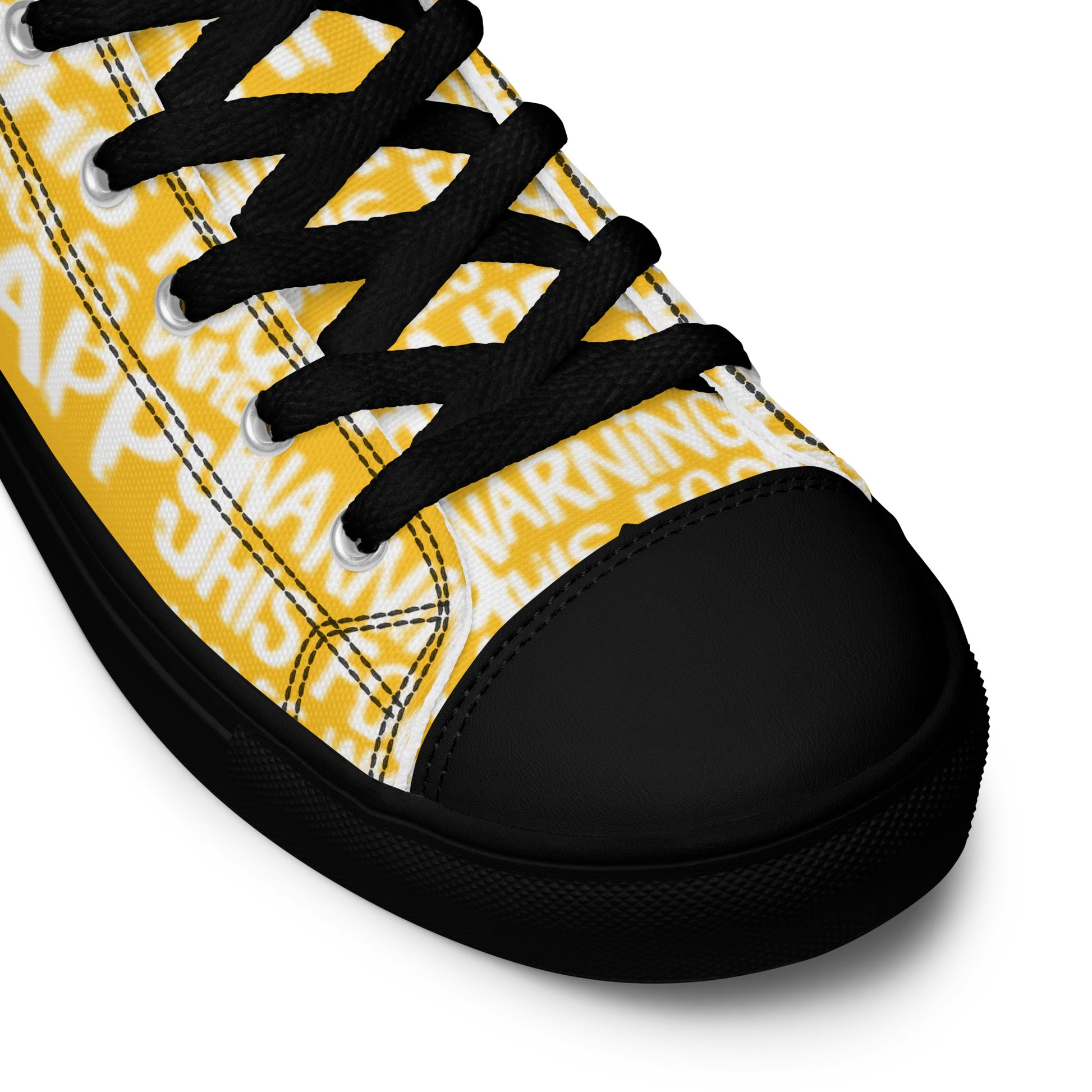 HappyStuff yellow high tops with playful white print Warning This Foot Jiggles When Happy black laces faux leather toe cap closeup black sole