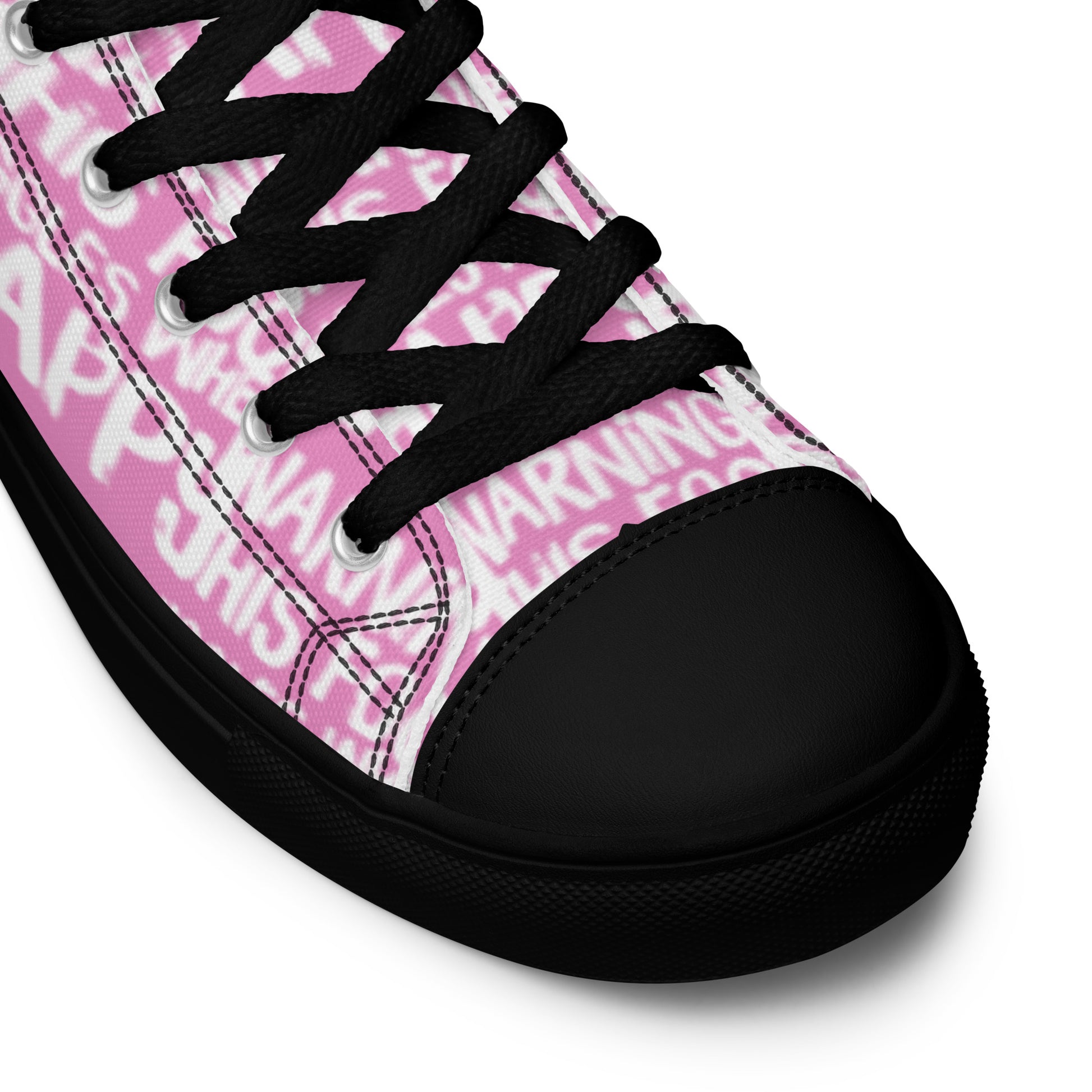 HappyStuff pink high tops with playful white print Warning This Foot Jiggles When Happy black laces faux leather toe cap closeup black sole