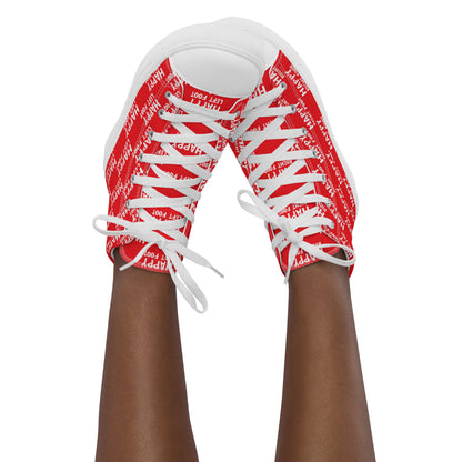 Womans sneaker clad feet in the air tapping toes of her high tops Happy Left Foot Happy Right Foot Pattern Print each on relevant shoe red and white shoes