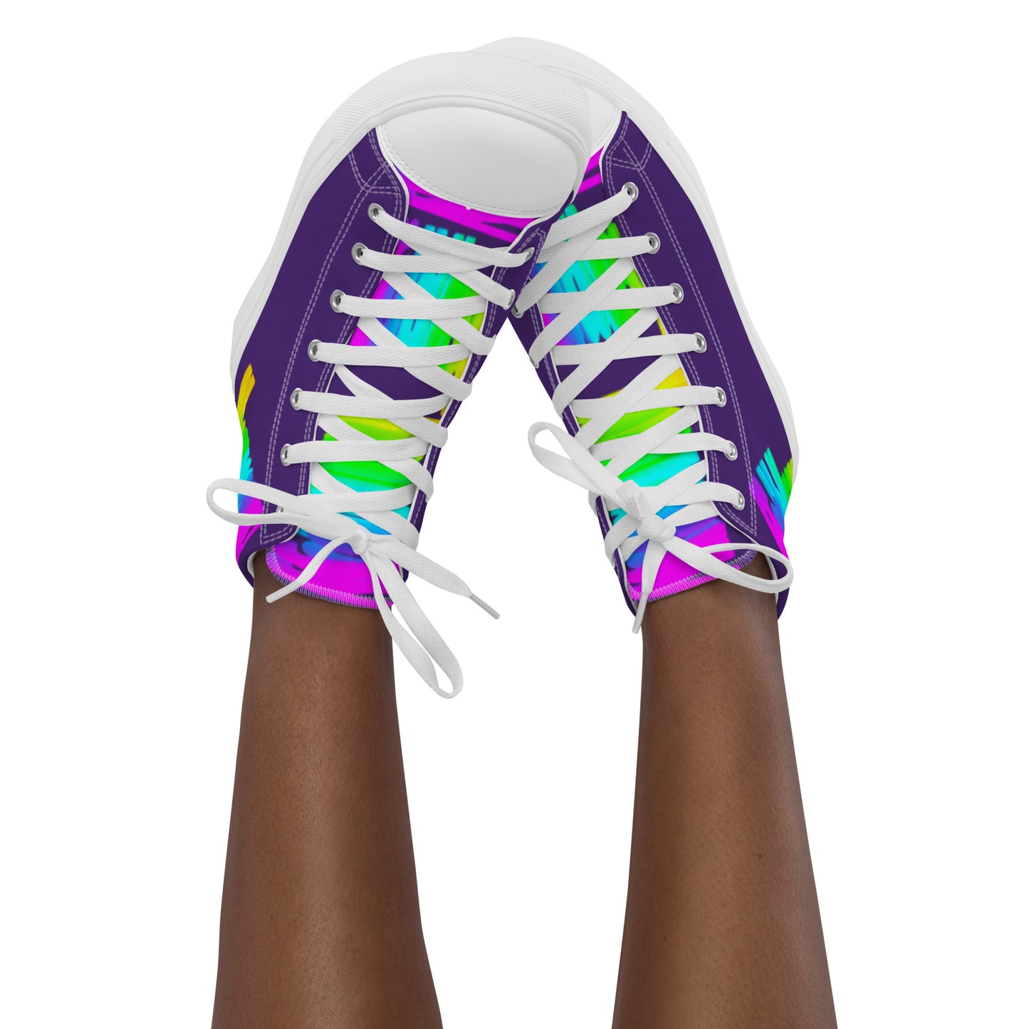 Feet in the air wearing womens sneakers tapping toes of her Happy Rainbow Painted bright colour spectrum print purple high tops