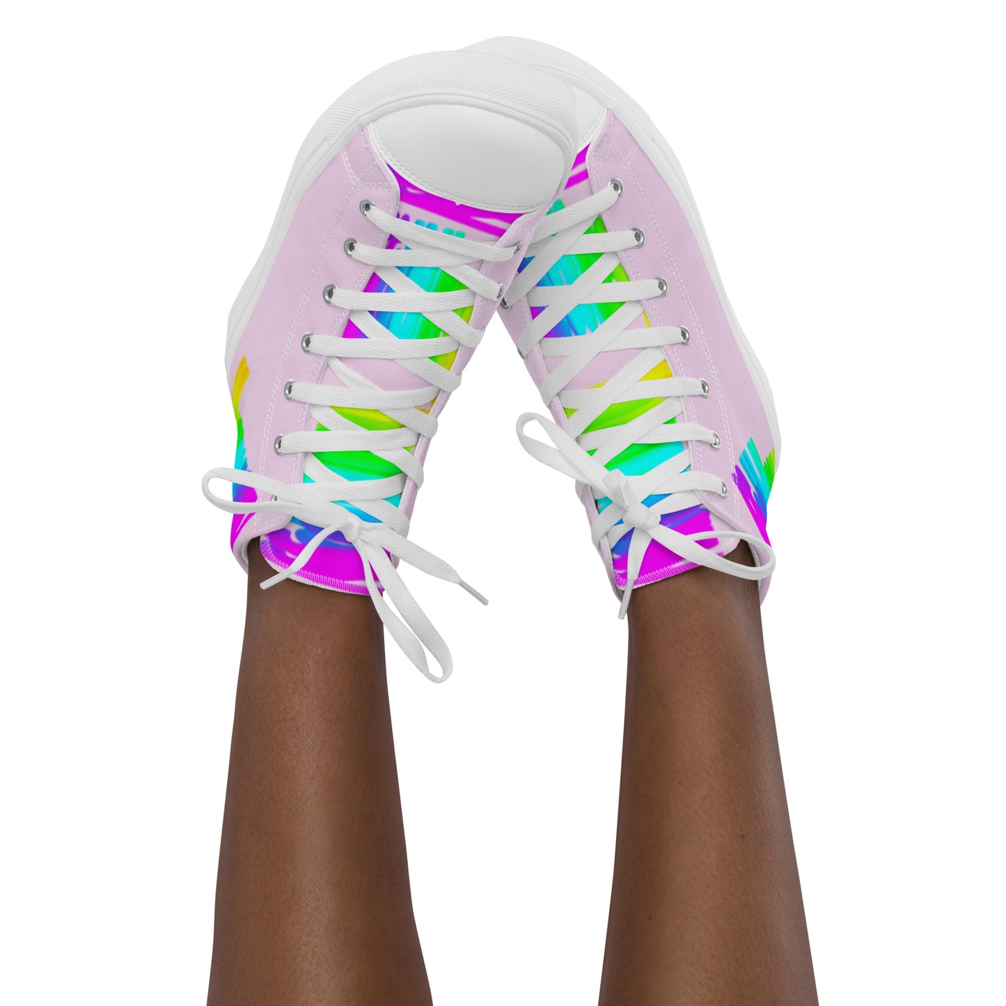 Feet in the air wearing womens sneakers tapping toes of her Happy Rainbow Painted bright colour spectrum print pink high tops