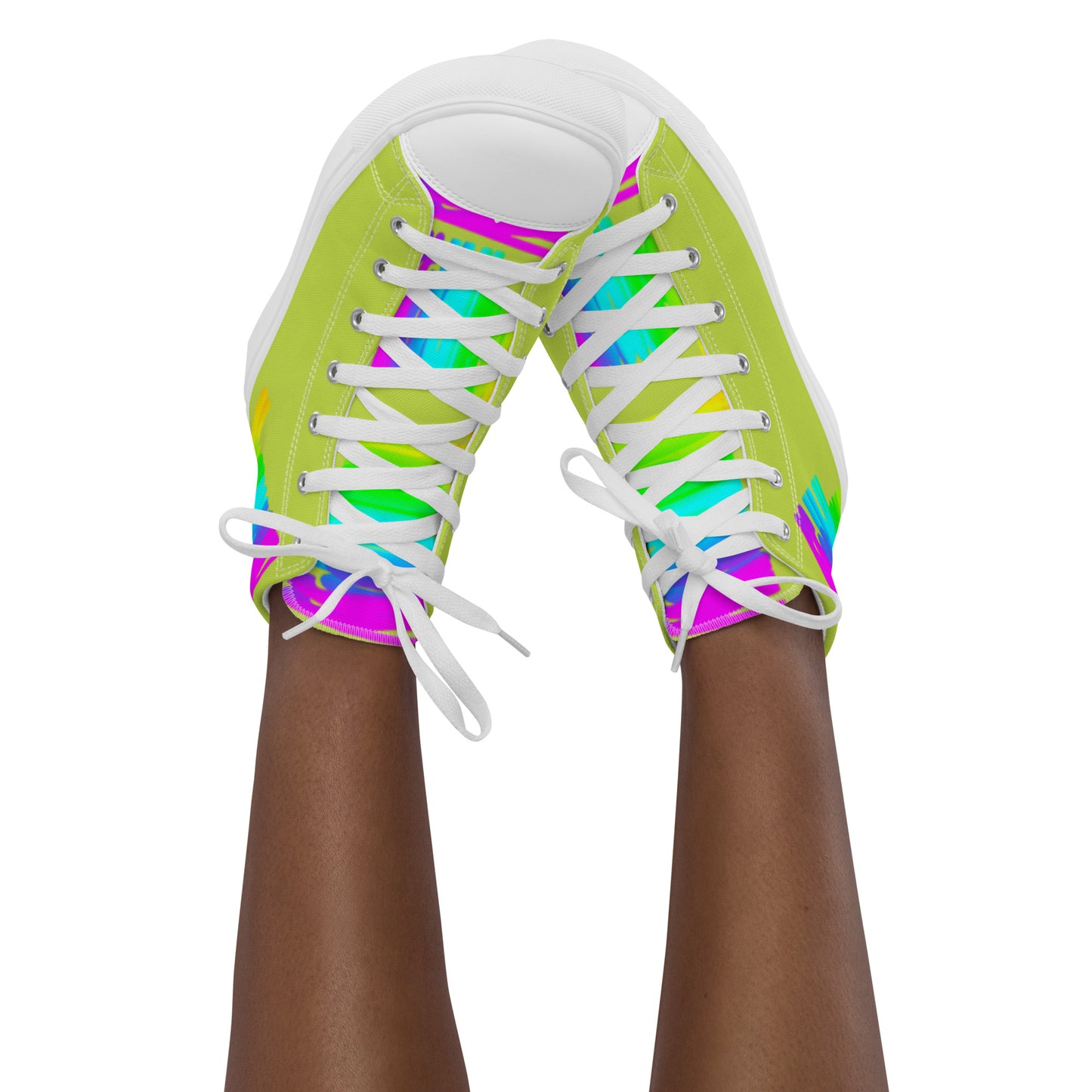 Feet in the air wearing womens sneakers tapping toes of her Happy Rainbow Painted bright colour spectrum print green high tops