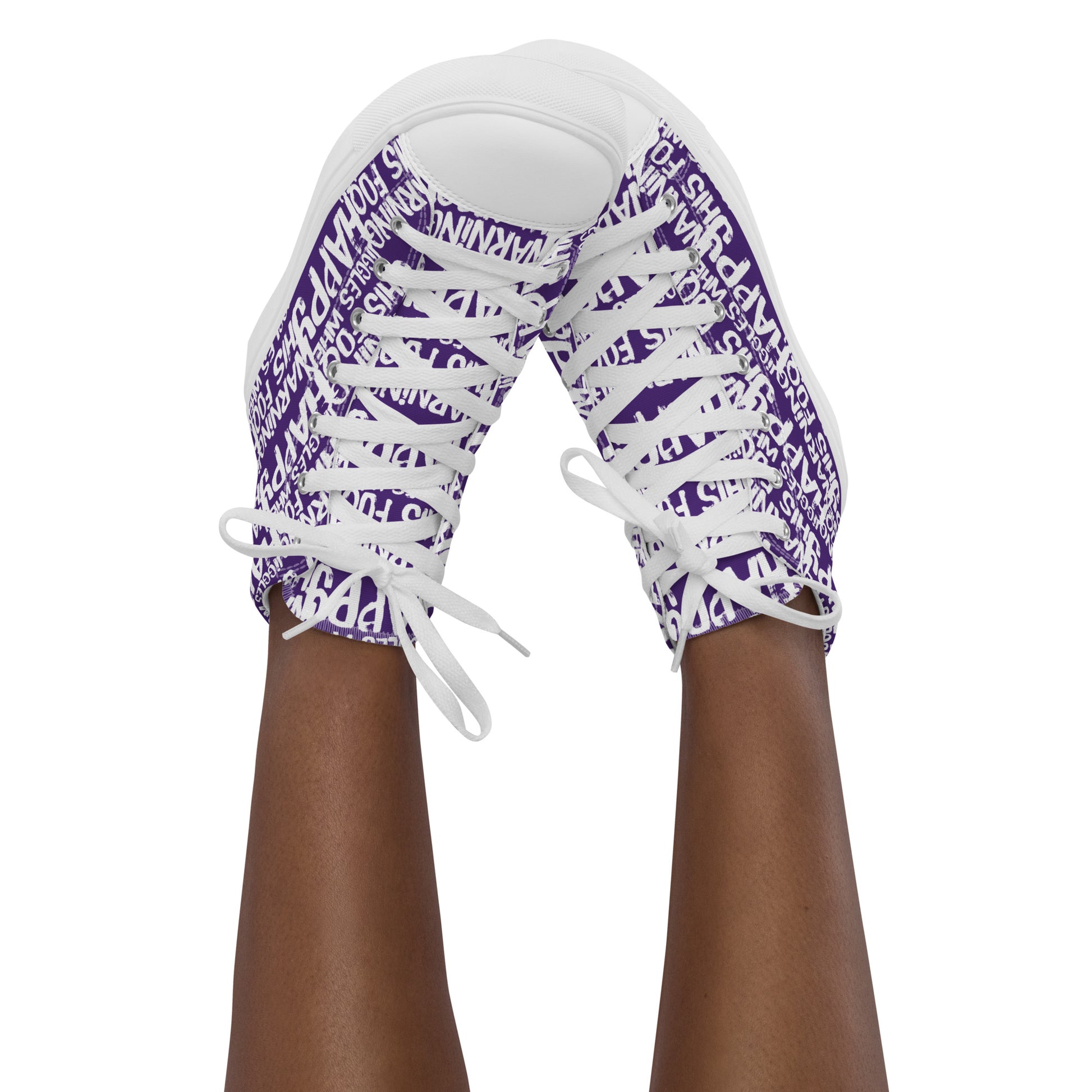 Womans feet in the air tapping toes of her high tops playful purple and white print Warning This Foot Jiggles When Happy