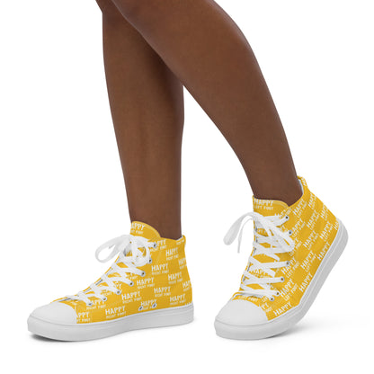 Walking left in womens HappyStuff high tops yellow canvas sneakers Happy Left Foot Happy Right Foot Pattern Print each on relevant shoe