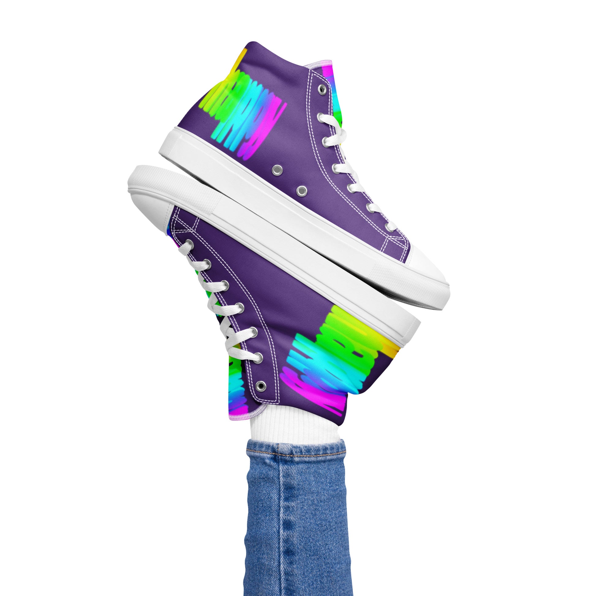 Womans right foot propping up Happy Rainbow Painted bright colour spectrum print purple high tops balancing left sneaker atop