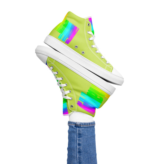 Womans right foot propping up Happy Rainbow Painted bright colour spectrum print green high tops balancing left sneaker atop